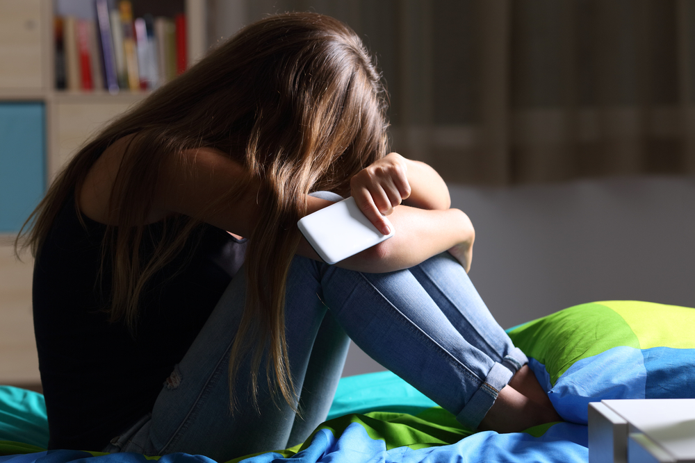 How can schools prevent cyber-bullying?